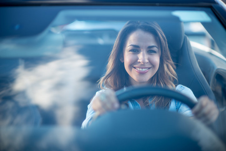 Female Driver Holding The Wheel