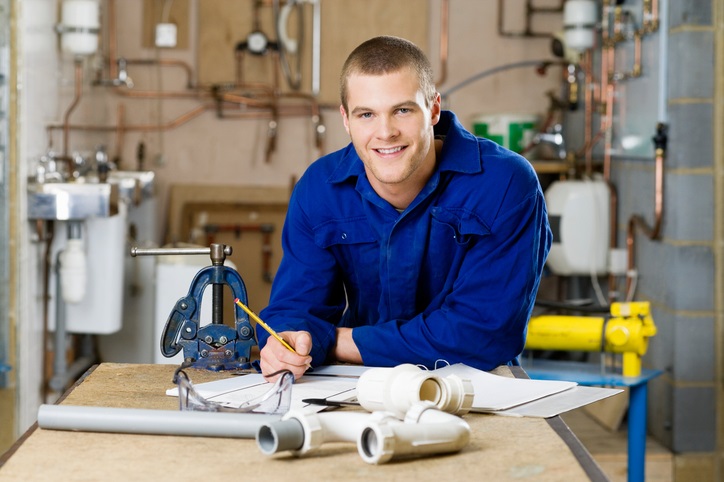 Plumber Standing at Workbench